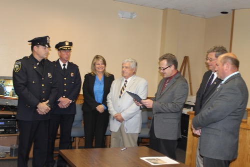 Riverhead Police Officer Tim Murphy, left, made more DWI arrests in 2014 than any other cop on the Riverhead PD. He has led the force in DWI collars every year since he joined the department in 1999. Yesterday the town board honored Murphy with a certificate of appreciation.