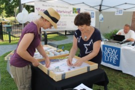 A hands-on mosaic demonstration by Linda Purrazzella at River & Roots Community Garden. File photo:Denise Civiletti