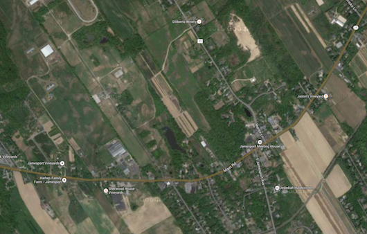 The property is on the north side of Route 25, just west of Jamesport's hamlet center. Google Maps image.