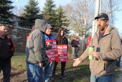 Verizon picket line leader Brian Keller speaks to striking workers outside the Riverhead garage, Photo: Denise Civiletti