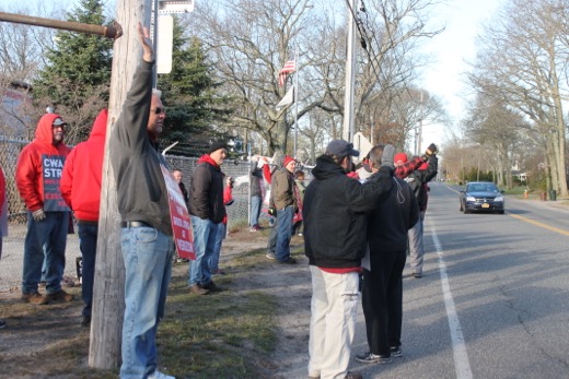 Strikers waves to passing motorists who honked their horns in support.Photo:Denise Civiletti