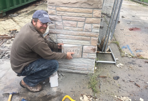 Mason Walter McKay removed the cornerstone before the wall was torn down, to see if there was a time capsule behind or under it. Photo: Peter Blasl