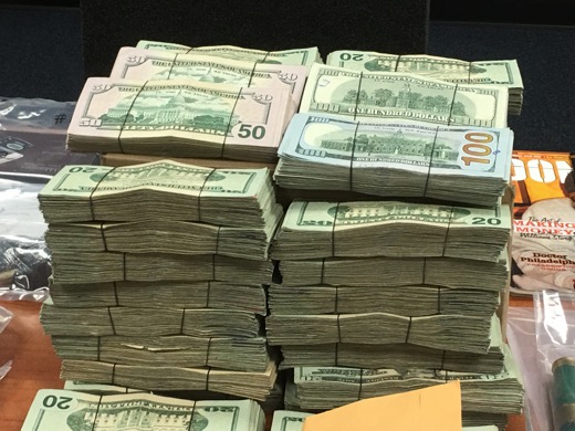 Some of the cash seized by law enforcement officers during the recent raids. Photo: Denise Civiletti