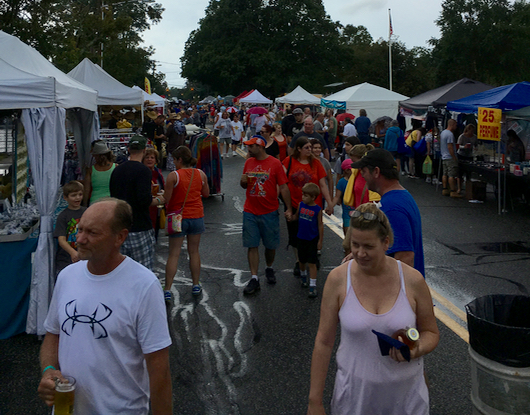 After the rain ended this afternoon, shoppers began to return to the street festival. Courtesy photo: Kevin Zaneski