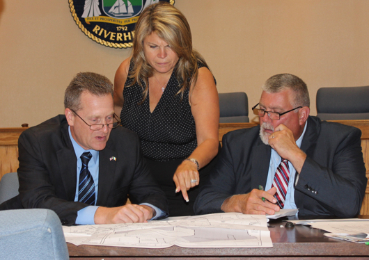 Supervisor Sean Walter, Councilwoman Jodi Giglio and Councilman Tim Hubbard review the EPCAL subdivision map during a work session last month. Photo: Denise Civiletti