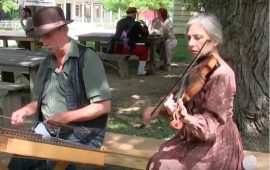 Larry Moser plays hammered dulcimer and Mary Nagin fiddles Photo Credit: Youtube