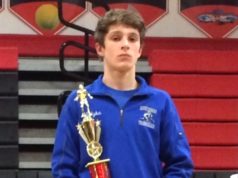 Riverhead wrestling team captain notches milestone 100th varsity win
