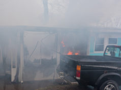 Fast-moving fire destroys home in Calverton mobile home park Sunday