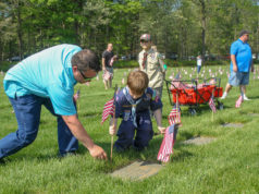 Photos: Scouts decorate graves at Calverton National Cemetery in annual Memorial Day tradition