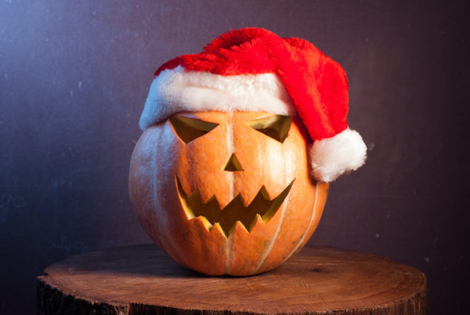 Jack-o ' - lantern in a red Santa hat,