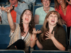 Laughter is the medicine for what ails us people-laughing-in-theater