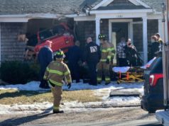 Truck crashes through front wall of house on West Main Street