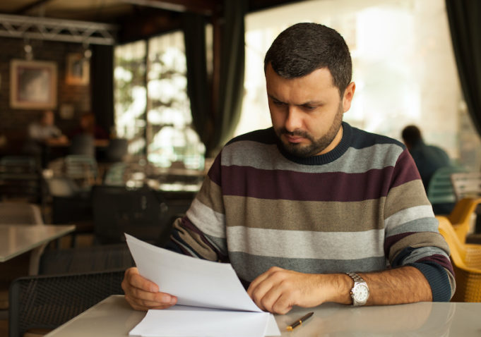 Worrie man reading a document
