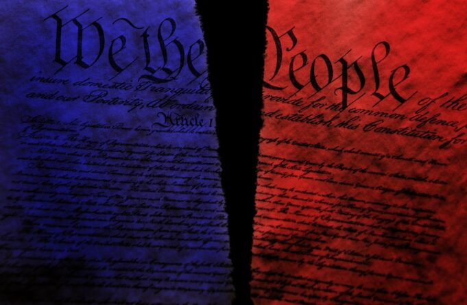 Torn US Constitution with red and blue split representing division in US politics