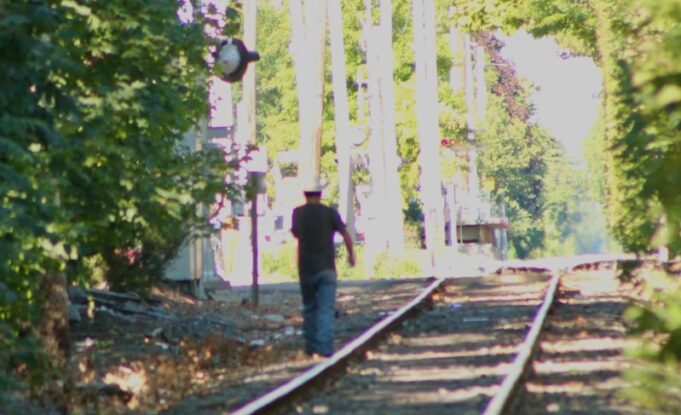 2025_0321_man walking on LIRR tracks - 1