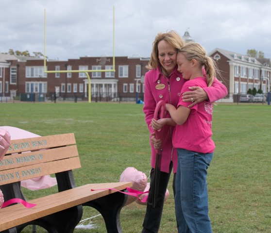 Kait’s Angels co-founder Darla Doorhy and Pulaski Street School fifth grader Taya Fusco cut the ribbon to unveil the buddy bench.