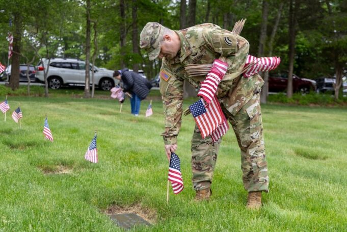 2026_0524_soldier placing flags - 1